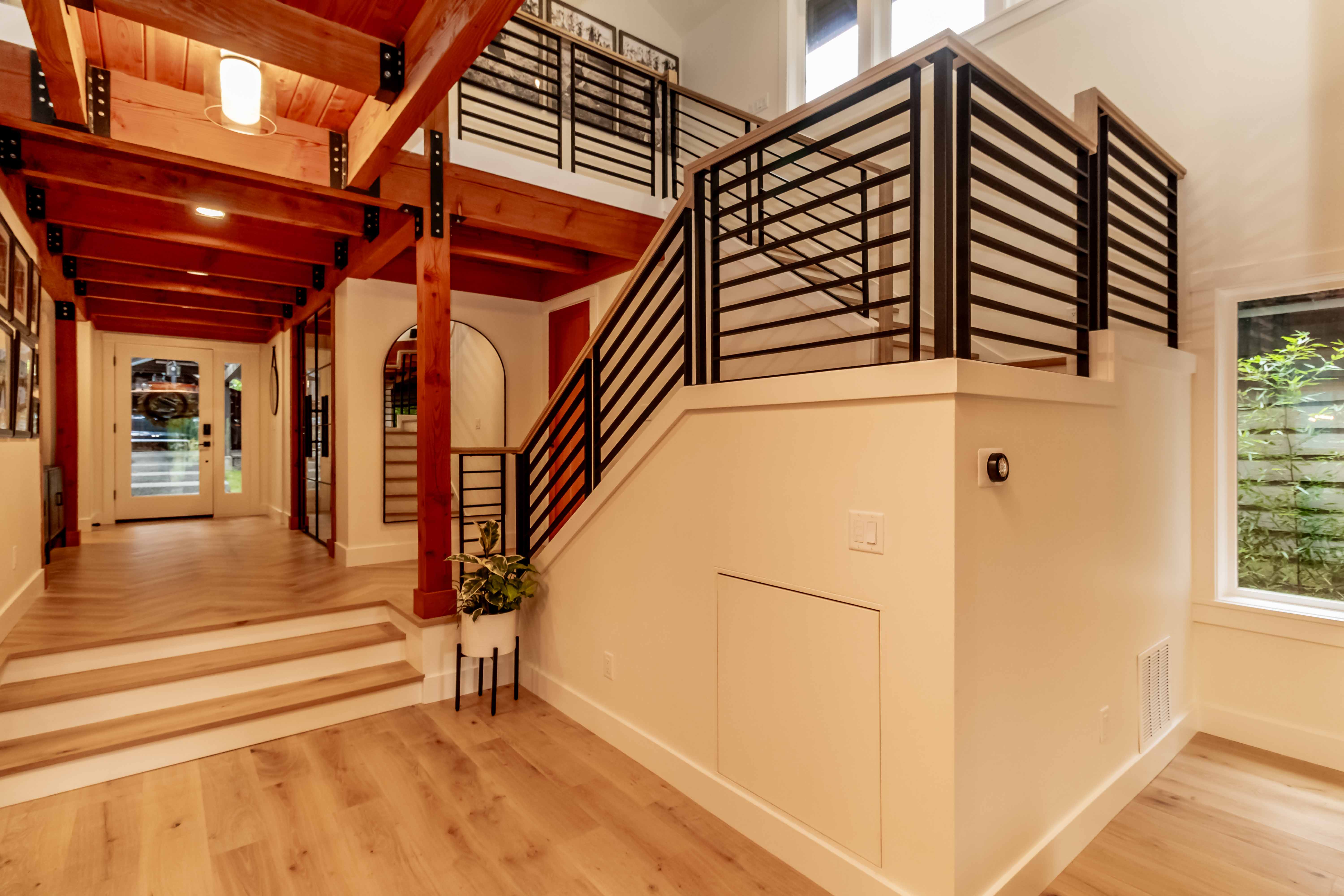 Custom staircase with metal railing and wood floors, Beaver Lake
